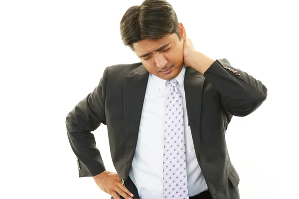 Stanco e stressato uomo d'affari asiatico — Foto Stock