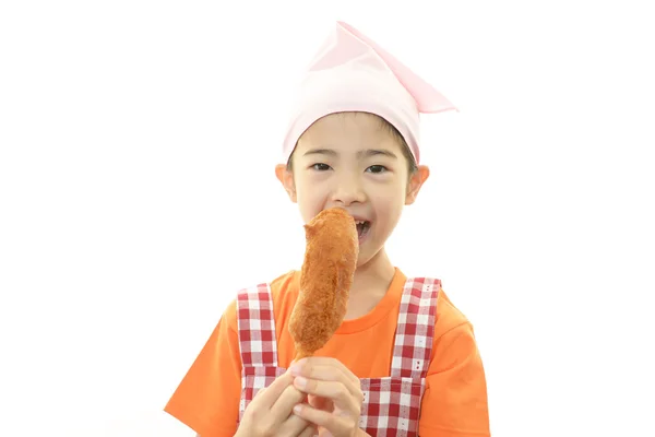 Girl eating corn dog — Stock Photo, Image