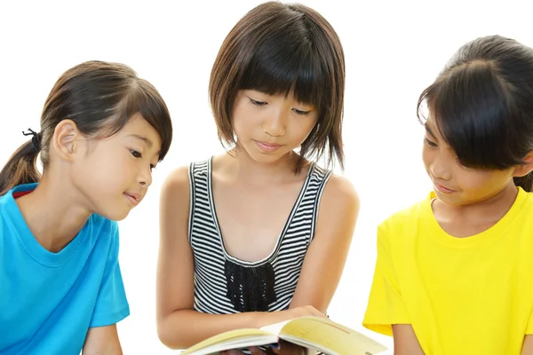 Girls reading a book — Stock Photo, Image