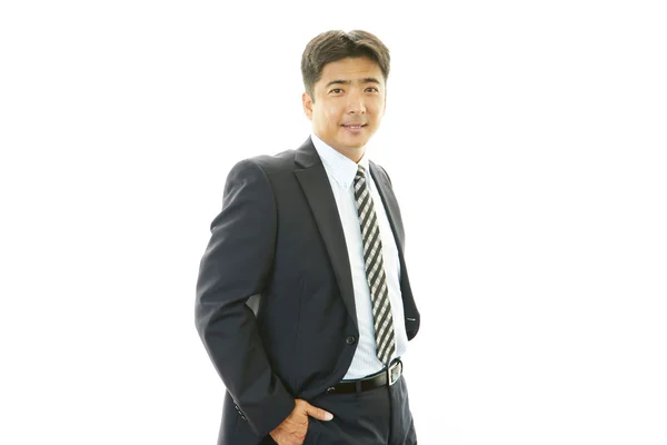 Lächelnder asiatischer Geschäftsmann — Stockfoto