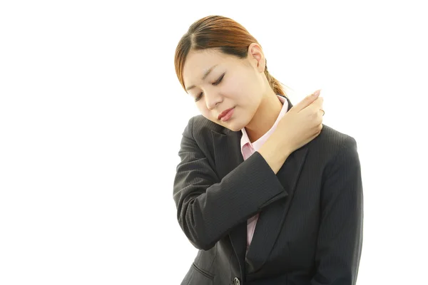 Business woman with shoulder pain. — Stock Photo, Image