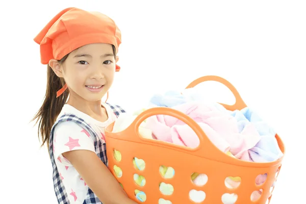 Smiling Asian girl with laundry — Stock Photo, Image