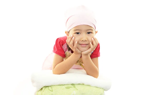 Smiling Asian girl with laundry — Stock Photo, Image