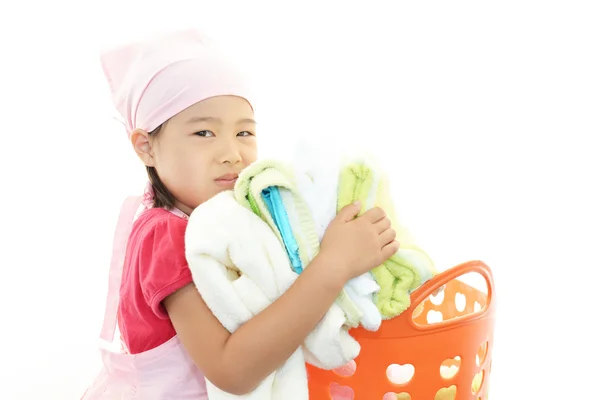 Sonriente chica asiática con lavandería —  Fotos de Stock