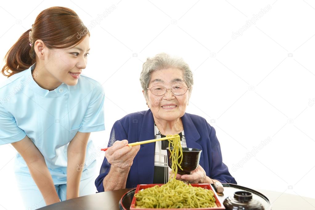 Old woman eating food