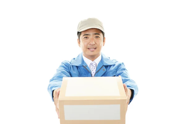 Asian courier delivering a package — Stock Photo, Image