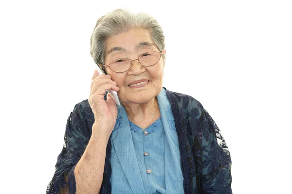 Mobile phone and old woman — Stock Photo, Image