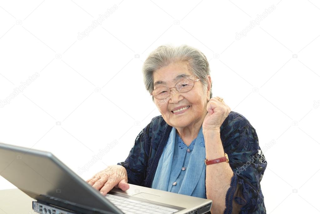 Senior lady enjoys computer