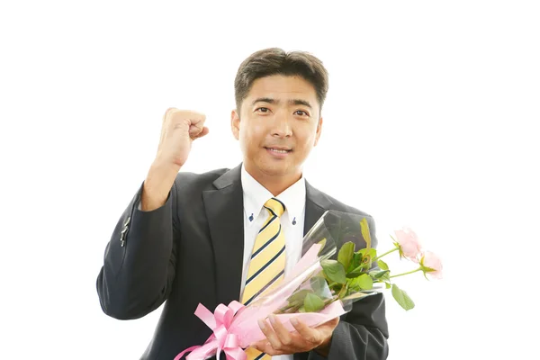 Man holding flowers — Stock Photo, Image