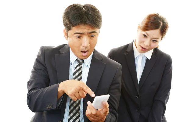 Surprised businessman and businesswoman — Stock Photo, Image