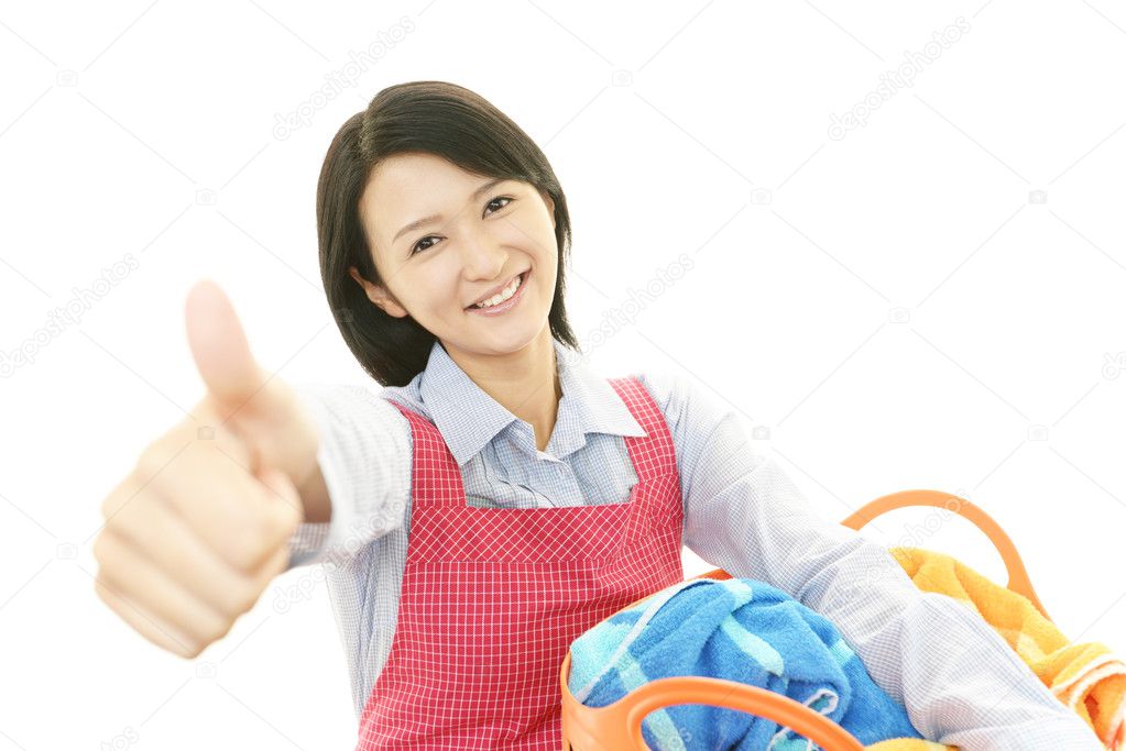 The woman is holding a Laundry basket
