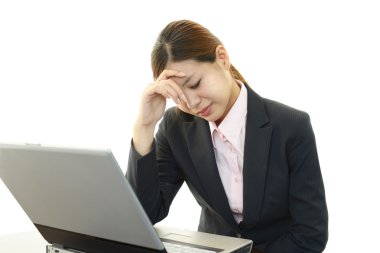 Tired Asian business woman