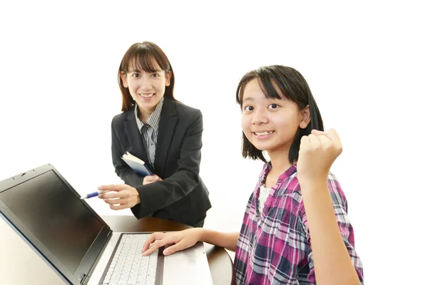 Teacher with girls studying. — Stock Photo, Image