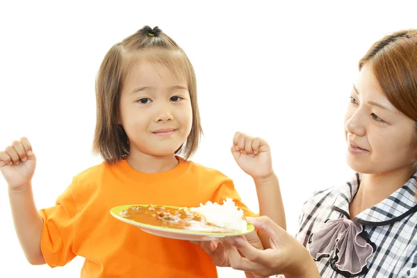 Smiling child eating food — Stock Photo, Image