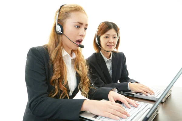 Surprised call center operators — Stock Photo, Image