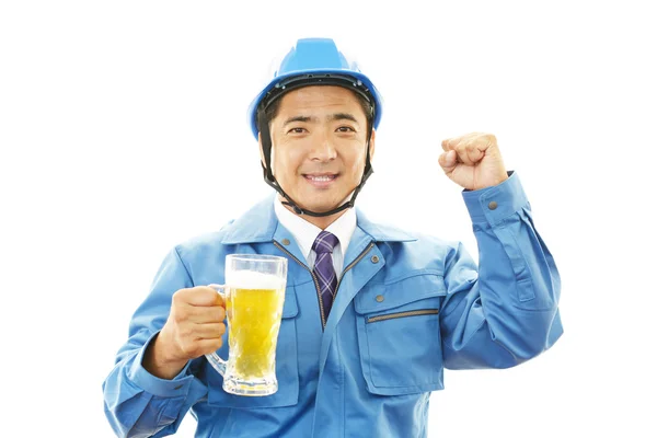 Asian worker drinking beer — Stock Photo, Image