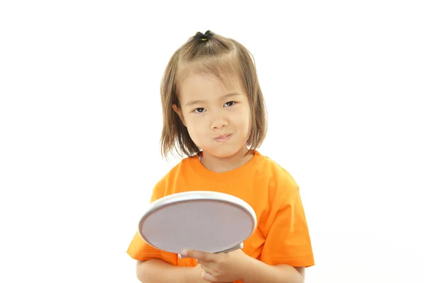Little girl holding a hand mirror — Zdjęcie stockowe