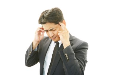 baş ağrısı olan işadamı
