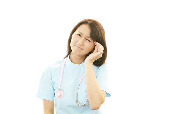 Nurse having a headache — Stock Photo, Image