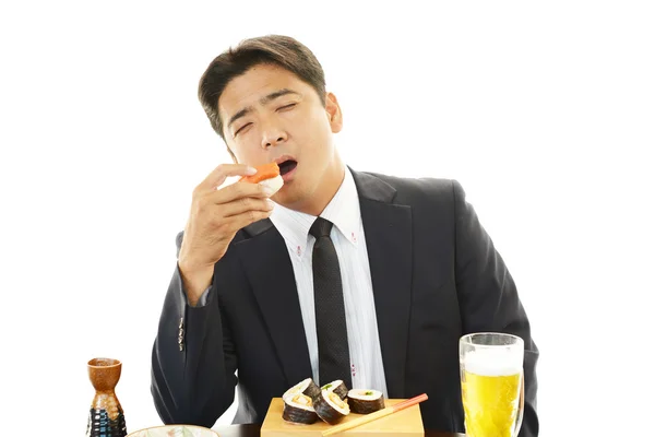 The man who eats sushi — Stock Photo, Image