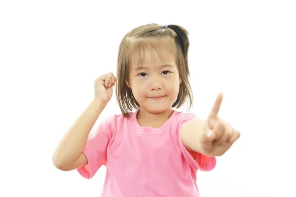 Sorridente asiatica bambina che punta . — Foto Stock