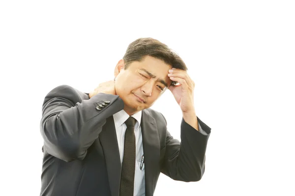 Tired and stressed Asian businessman — Stock Photo, Image