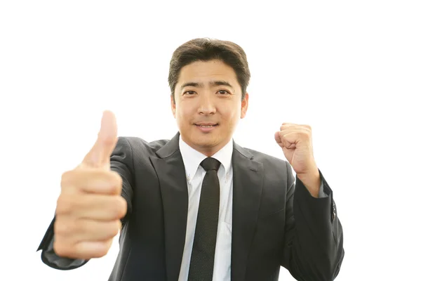 Feliz hombre de negocios mostrando pulgares hacia arriba signo —  Fotos de Stock