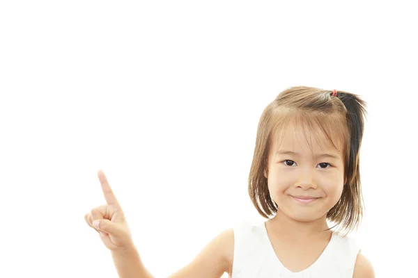 Menina asiática pequena apontando . — Fotografia de Stock