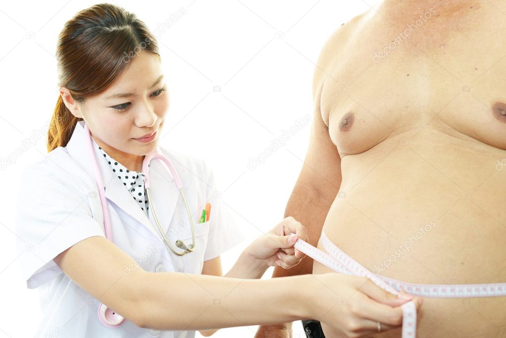 Serious doctor examining a patient obesity