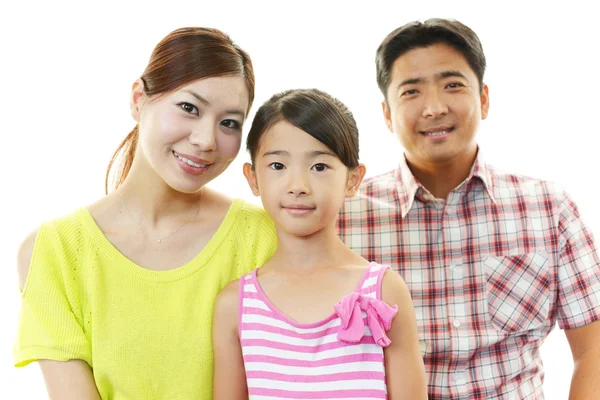 Glückliche Familie lächelt zusammen — Stockfoto