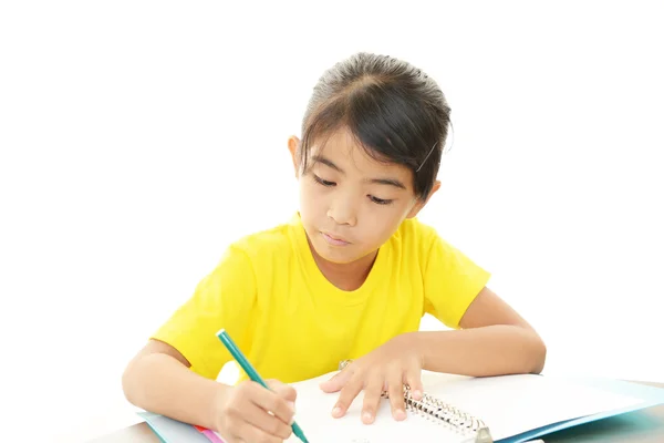 Ragazza che studia alla scrivania — Foto Stock