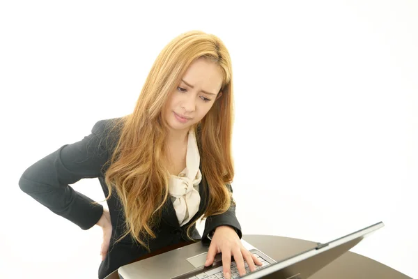 Mujer de negocios con dolor de espalda —  Fotos de Stock