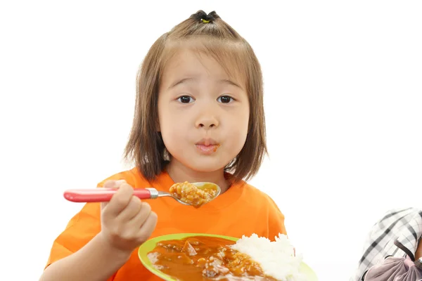 Little girl eating food — Stock Photo, Image