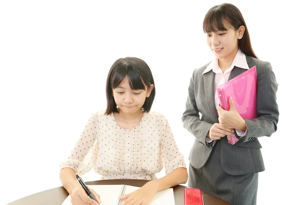 Teacher with girl studying. — Stock Photo, Image