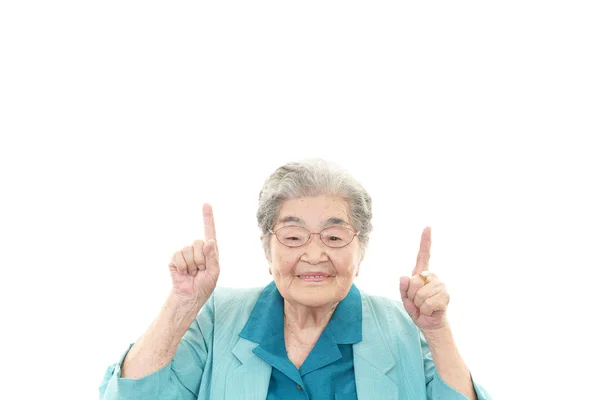 Yaşlı kadın işaret. — Stok fotoğraf