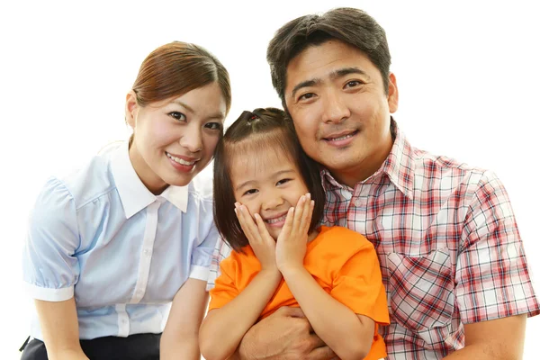 Glückliche Familie lächelt zusammen — Stockfoto