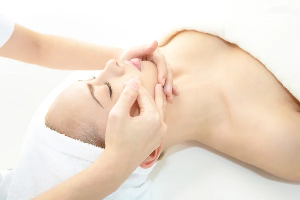 Pretty woman receiving facial massage — Stock Photo, Image