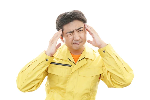 Tired and stressed Asian worker — Stock Photo, Image