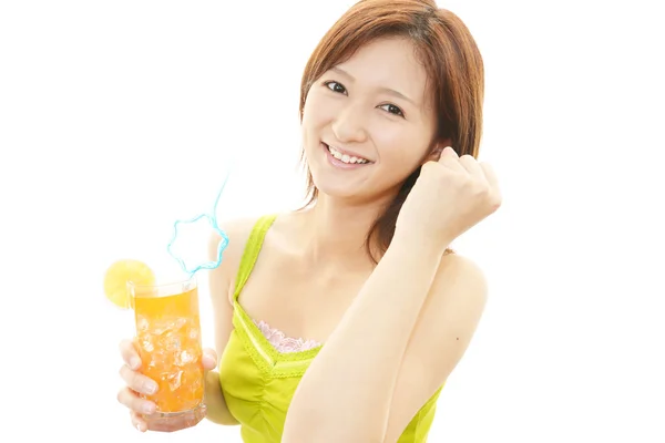 Smiling woman with juice — Stock Photo, Image