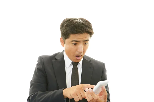 Surprised Asian businessman — Stock Photo, Image
