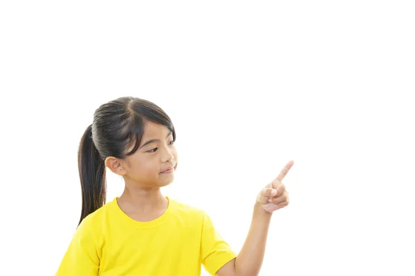 Menina asiática apontando — Fotografia de Stock