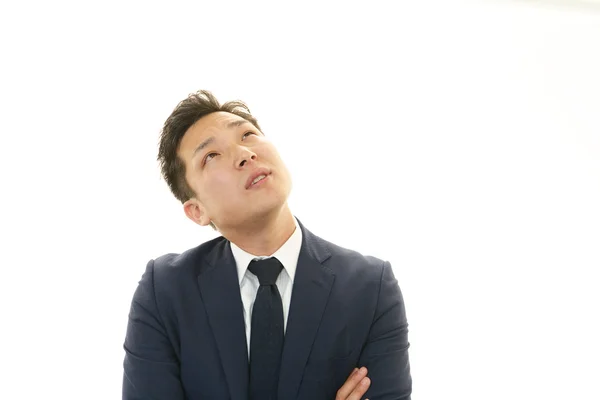 Depressed Asian businessman. — Stock Photo, Image