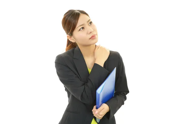 Tired young Asian business woman — Stock Photo, Image