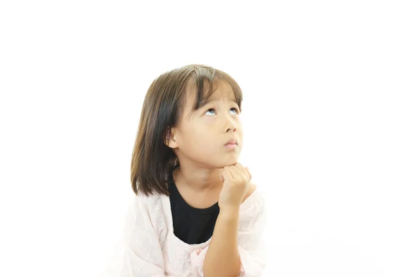 Little Asian girl uneasy look — Stock Photo, Image