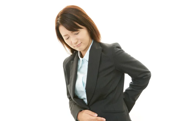 Business women having back pain. — Stock Photo, Image