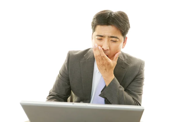 Sleepy asiático hombre de negocios . — Foto de Stock