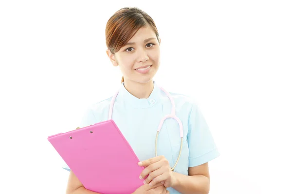 Sorridente asiatica infermiera femminile — Foto Stock