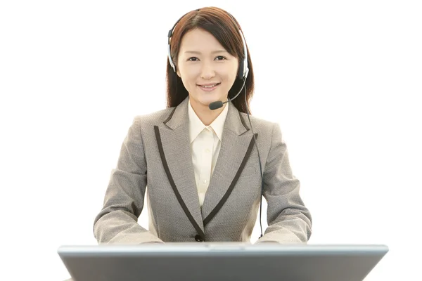 Smiling call center operator — Stock Photo, Image