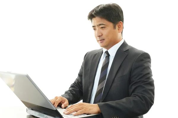 Businessman using laptop — Stock Photo, Image