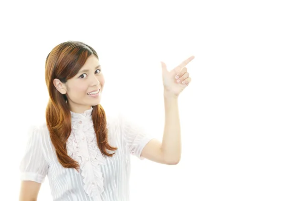 Young woman pointing — Stock Photo, Image